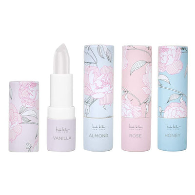 Nicole Miller 4 Pack Moisturizing Lip Balm Collection, Lip Softening Gift Set, Perfect Gift for Women and Girls (Vanilla, Almond, Rose & Honey)